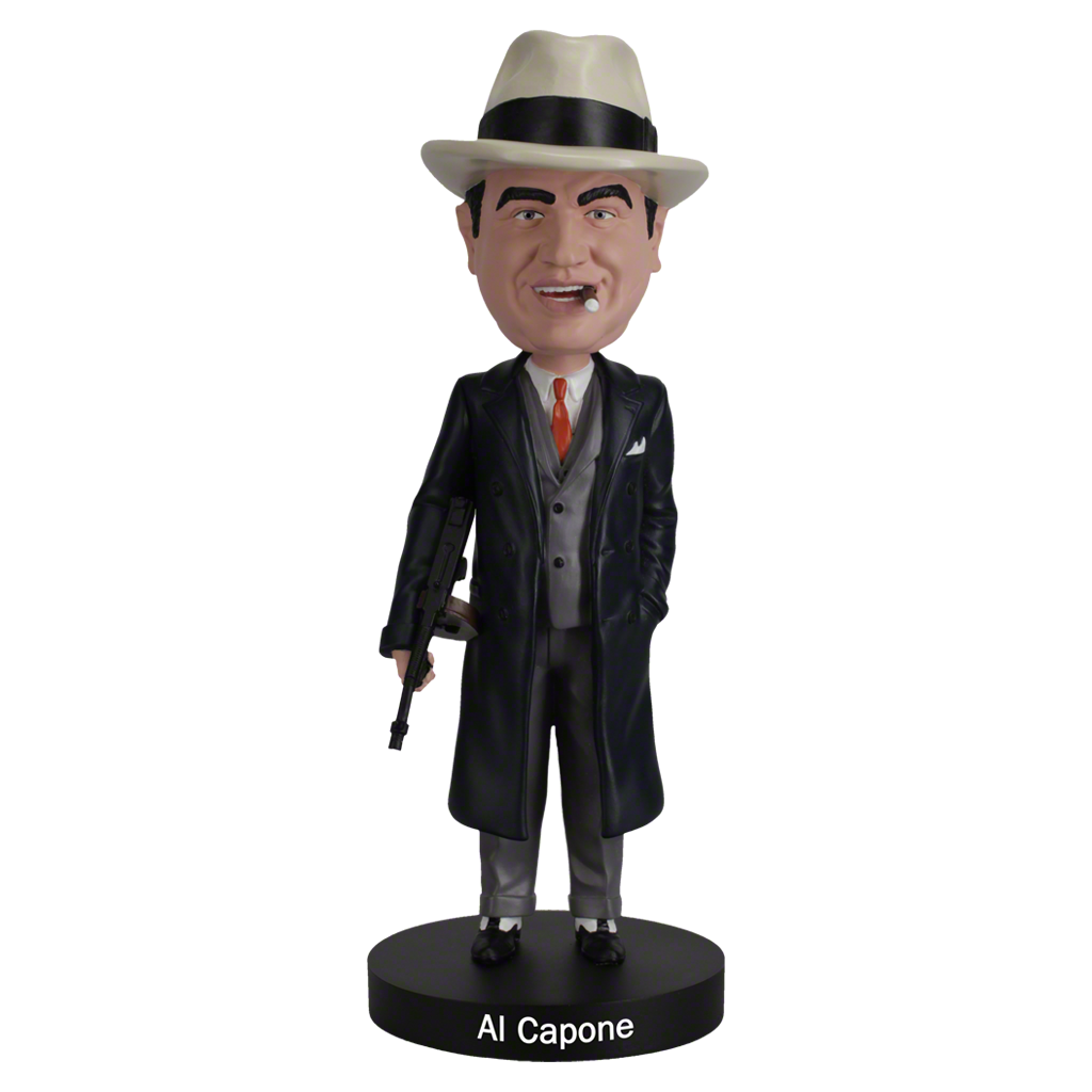 Al Capone bobblehead, wearing a white fedora, dark trench coat, and suit, holds a gun with a smirk. The base is labeled "Al Capone." Retro and playful tone.