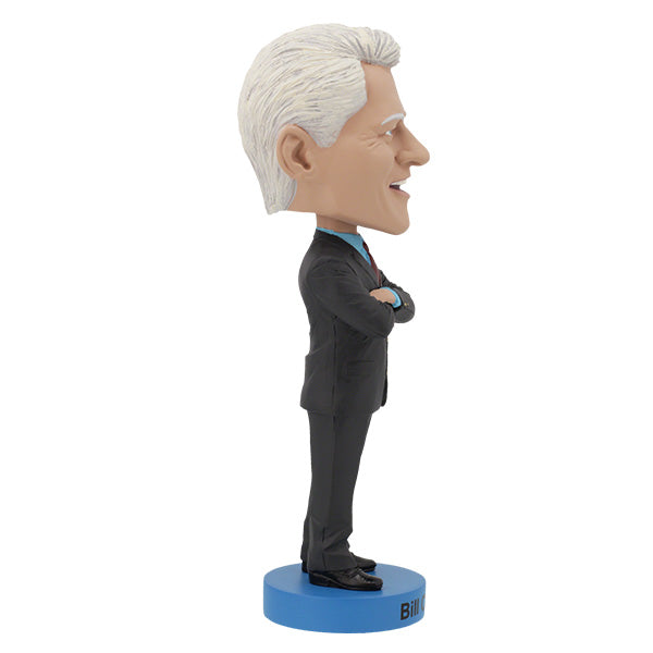 Right side view features Bill Clinton bobblehead with gray hair, red tie, standing on a blue base labeled "Bill Clinton," arms crossed, smiling.