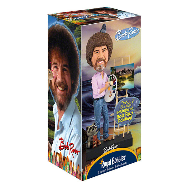Box featuring a Bob Ross bobblehead, wearing jeans and holding a palette beside an easel. Background shows a scenic mountain painting. Packaging reads "Royal Bobbles."