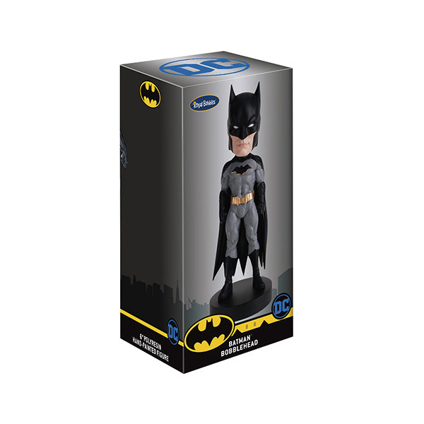 Batman bobblehead box with gray suit figure and Gotham skyline backdrop, DC branding