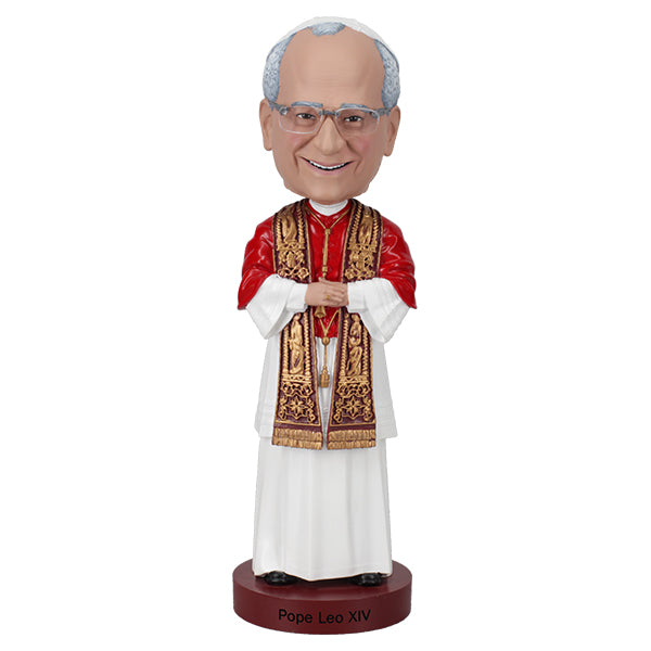 Bobblehead of a religious figure in formal attire on a white background
