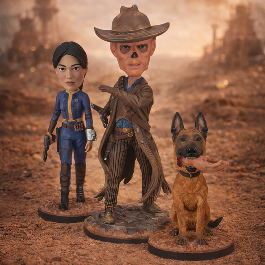 Three figurines of a woman, a man in a cowboy hat, and a dog on a desert background