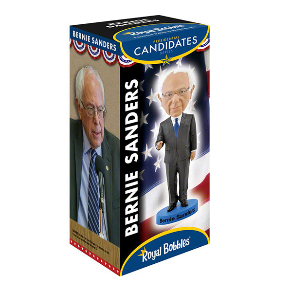 Box featuring a Bernie Sanders bobblehead on a patriotic background, with a photo of him speaking in a suit and tie. The tone is political and collectible.