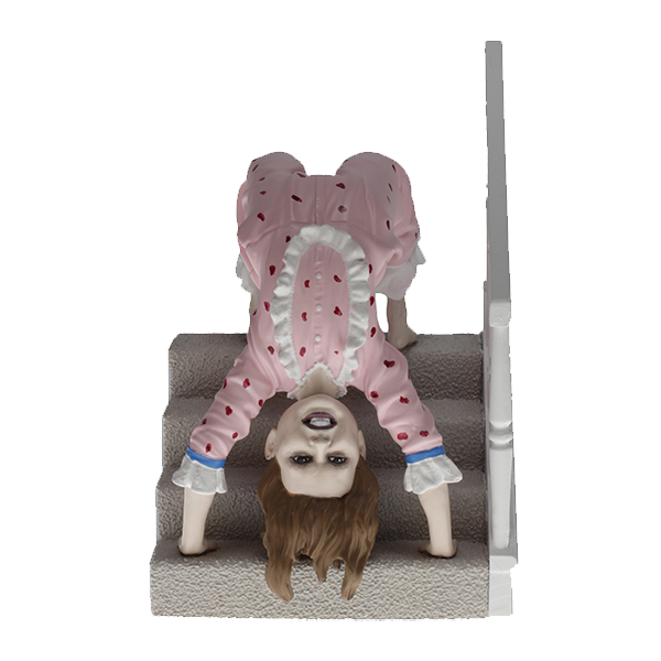 Creepy doll in pink nightgown crawling down carpeted stairs.