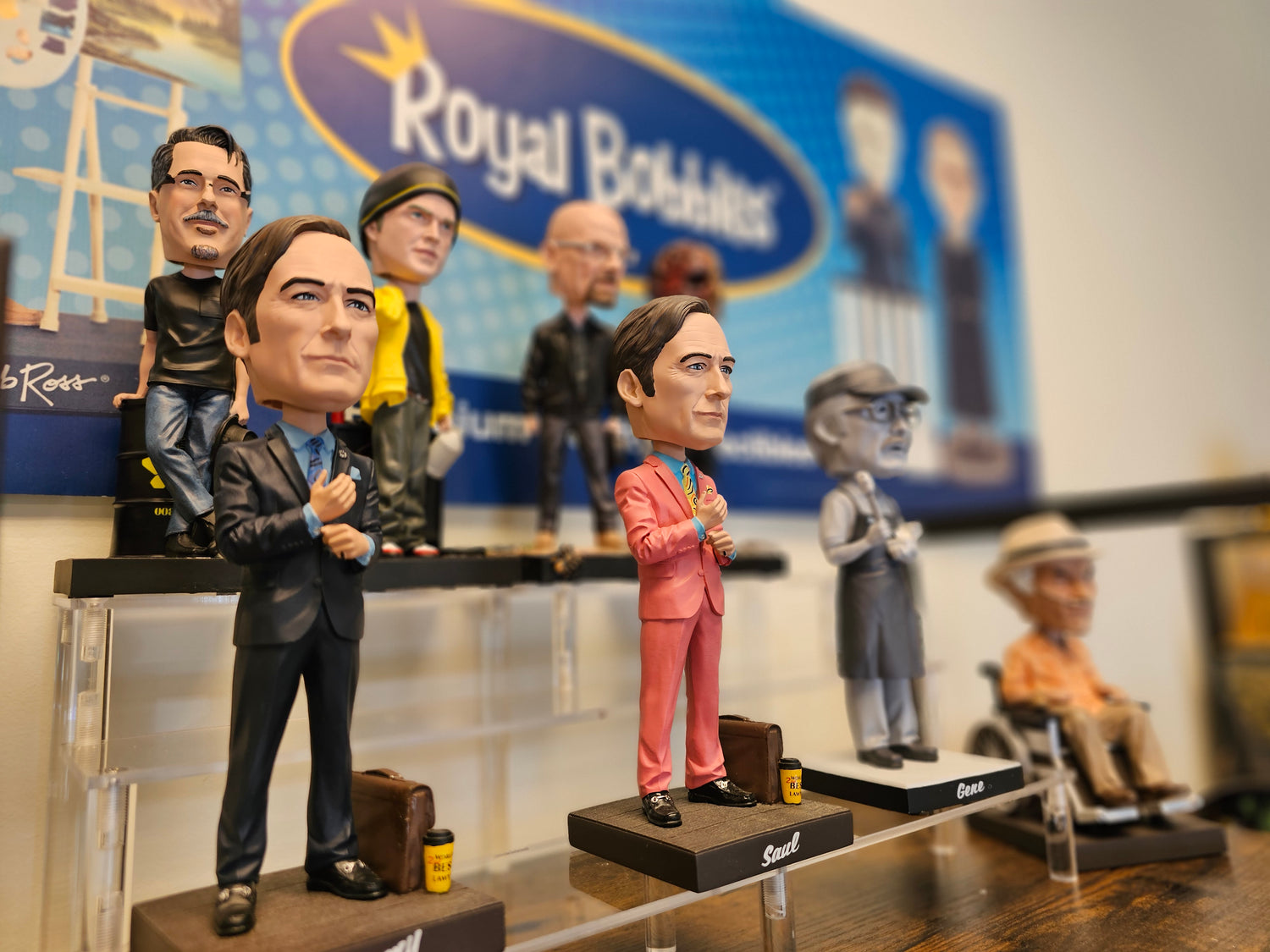 Image of Bobbleheads on Display Shelf with Royal Bobbles sign in background