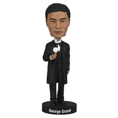 Bobblehead of George Grant in formal attire with a golf tee in hand