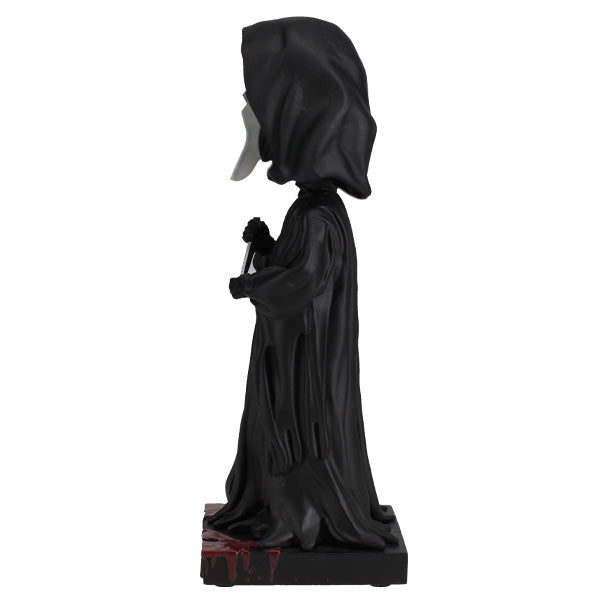 Black hooded figure with a long cloak on a white background