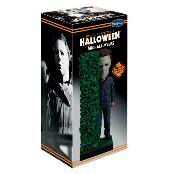 Michael Myers “Halloween” bobblehead box with masked figure by green hedge.
