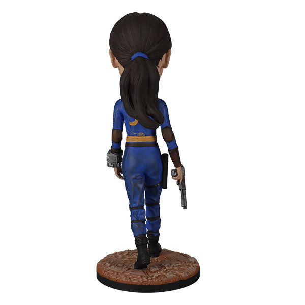 Bobblehed in blue costume with weapons on a white background