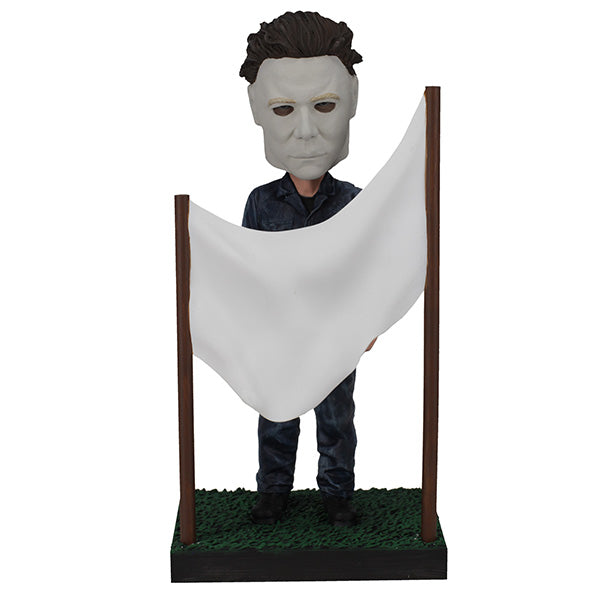 Michael Myers is standing behind a clothesline