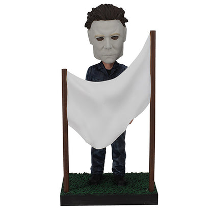 Michael Myers is standing behind a clothesline