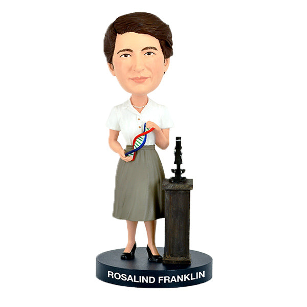 Bobblehead figure of Rosalind Franklin holding a model of DNA on a white background